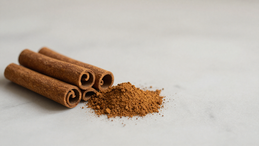 Ceylon cinnamon sticks and ground cinnamon on marble